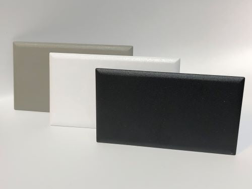 Black, White, and Gray Blank Telecom Plates shown together