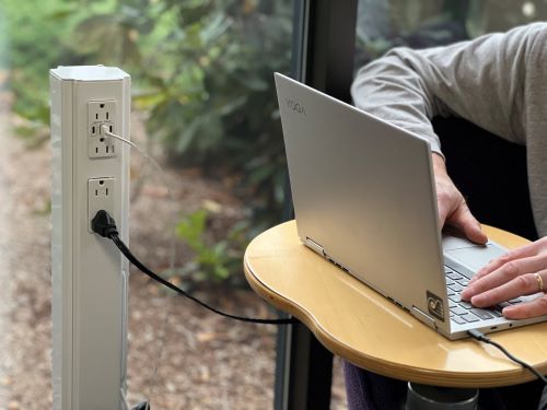 White MG Power Plus being used to charge Laptop